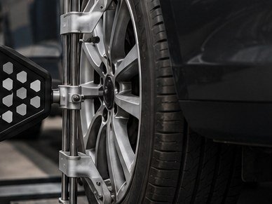 An alignment head clamped to an alloy wheel on the rig